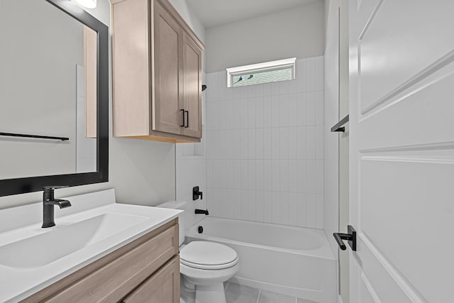 full bathroom with washtub / shower combination, toilet, vanity, and tile patterned flooring