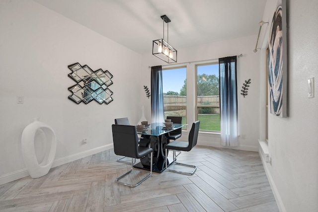 dining space featuring light parquet flooring