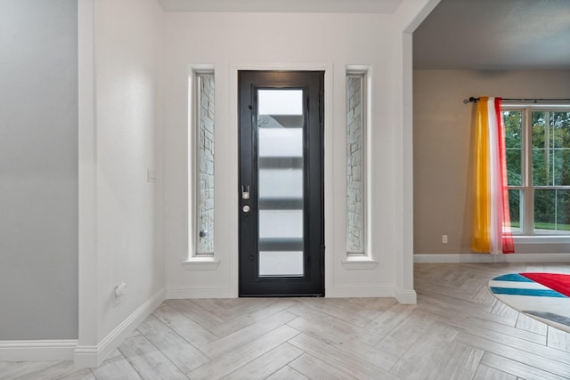 entryway with light parquet flooring