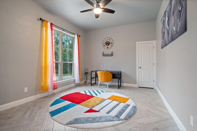 bedroom with ceiling fan and light parquet floors