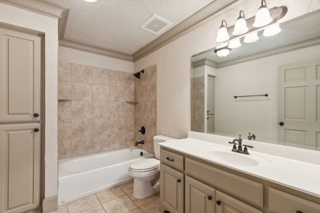 full bathroom featuring vanity, tiled shower / bath combo, tile patterned floors, crown molding, and toilet