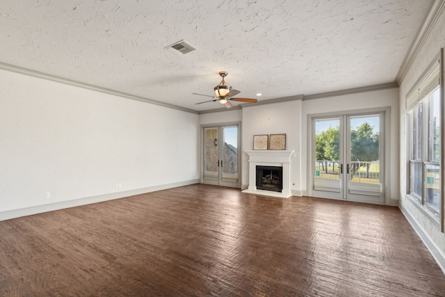 unfurnished living room featuring ceiling fan, ornamental molding, a textured ceiling, and dark hardwood / wood-style flooring