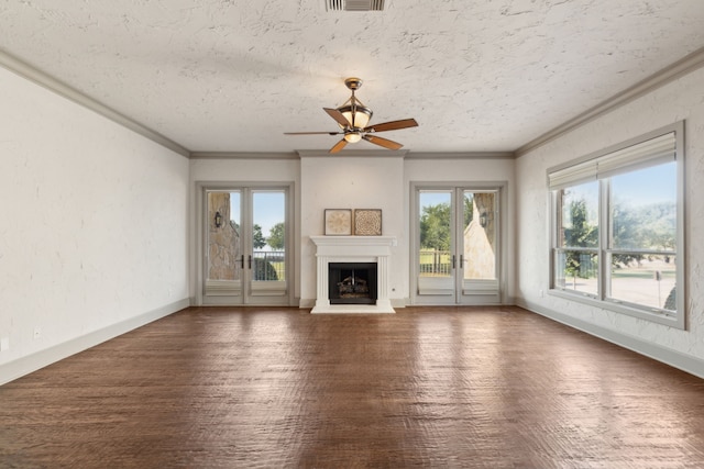 unfurnished living room featuring dark hardwood / wood-style floors, ornamental molding, a textured ceiling, and ceiling fan