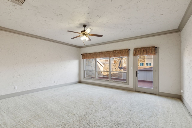 unfurnished room with crown molding, ceiling fan, carpet, and a textured ceiling