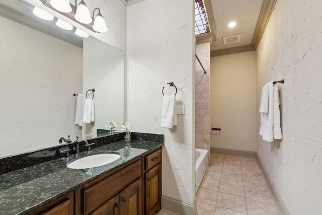 bathroom with tub / shower combination, vanity, ornamental molding, and tile patterned floors