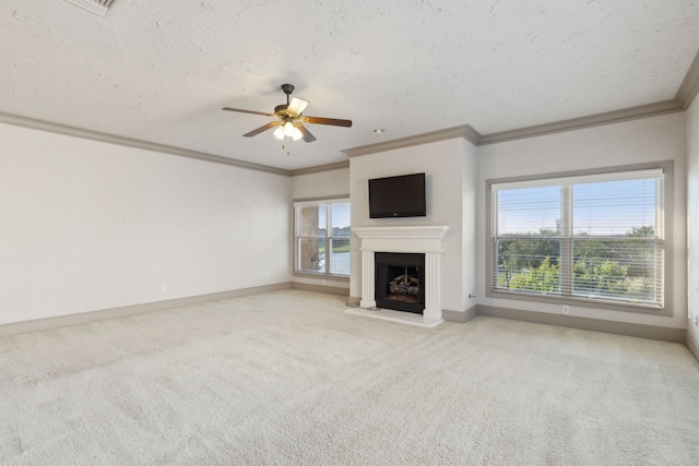 unfurnished living room with crown molding, light colored carpet, a textured ceiling, and ceiling fan