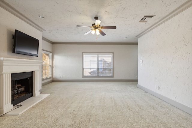 unfurnished living room featuring light carpet, a textured ceiling, crown molding, and ceiling fan