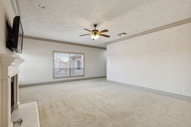 unfurnished living room featuring carpet floors, crown molding, a textured ceiling, and ceiling fan