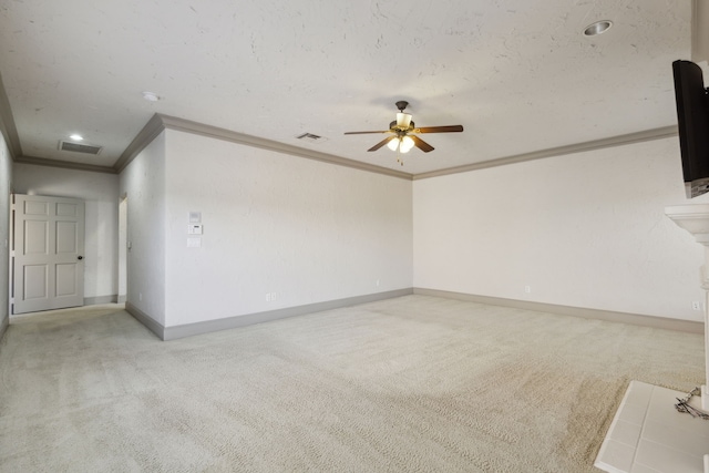 unfurnished room featuring light carpet, crown molding, and ceiling fan