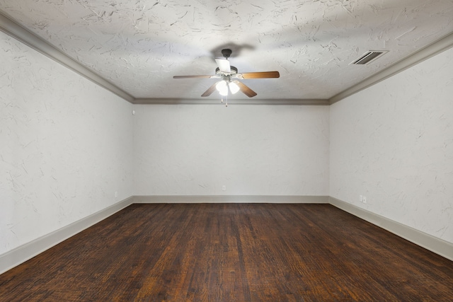 empty room featuring ceiling fan, hardwood / wood-style flooring, ornamental molding, and a textured ceiling