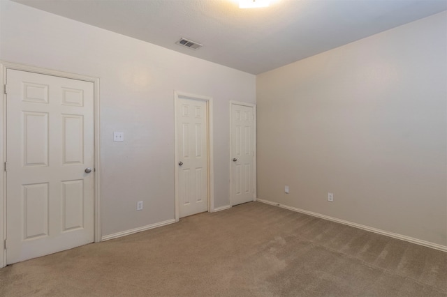 unfurnished bedroom with carpet flooring