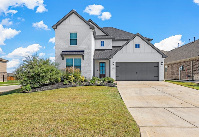 view of front facade featuring a front yard and a garage