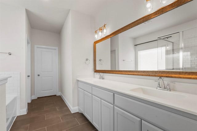 bathroom featuring tile patterned floors, vanity, and independent shower and bath