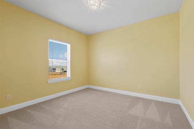 empty room featuring light colored carpet