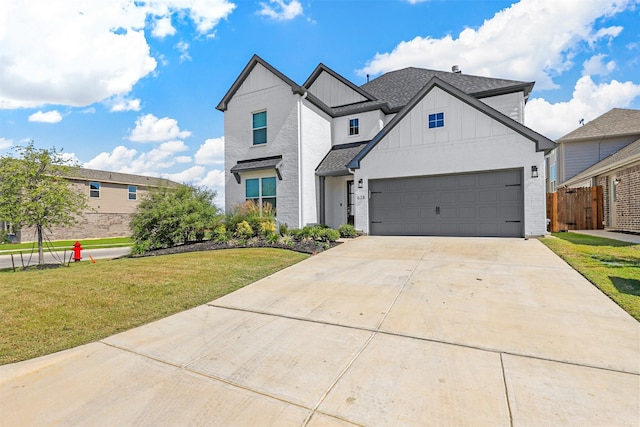 view of front of house featuring a front yard and a garage