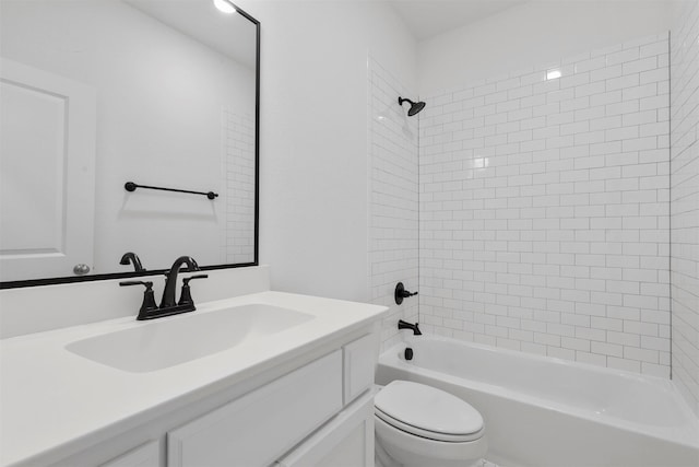 full bathroom with vanity, toilet, and tiled shower / bath