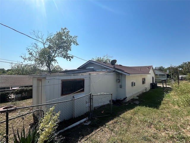 view of side of home featuring a lawn