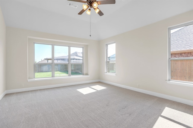 unfurnished room with ceiling fan and light carpet