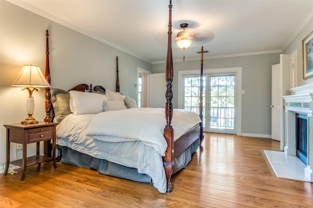 bedroom with ceiling fan, ornamental molding, access to outside, and light hardwood / wood-style flooring