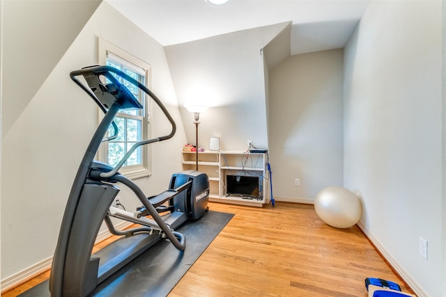 workout area featuring hardwood / wood-style floors