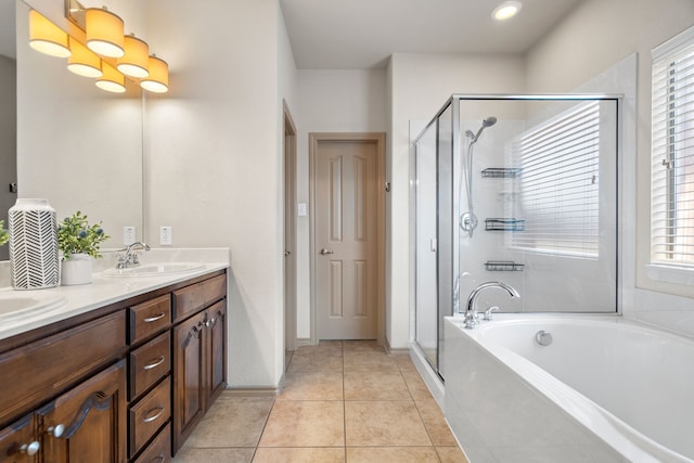 bathroom with vanity, shower with separate bathtub, and tile patterned flooring