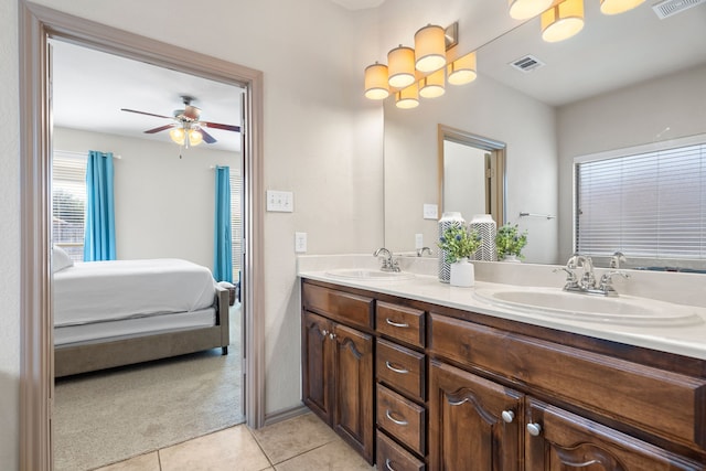 bathroom featuring ceiling fan, tile patterned flooring, and vanity