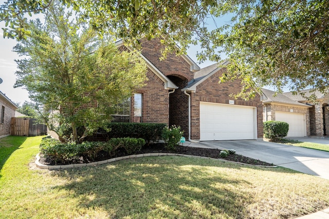 view of front facade with a garage and a front lawn