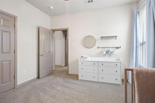 unfurnished bedroom featuring light carpet