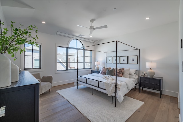 bedroom featuring light wood-type flooring and ceiling fan