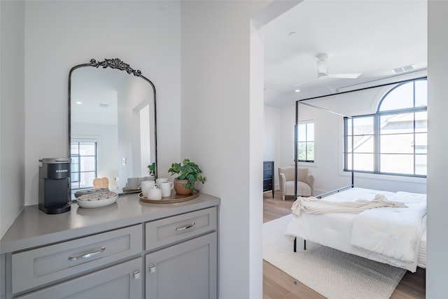 bedroom with light wood-type flooring and ceiling fan