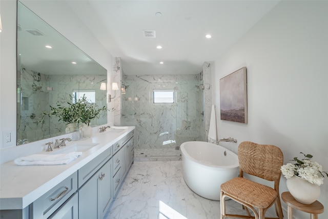 bathroom with independent shower and bath and vanity