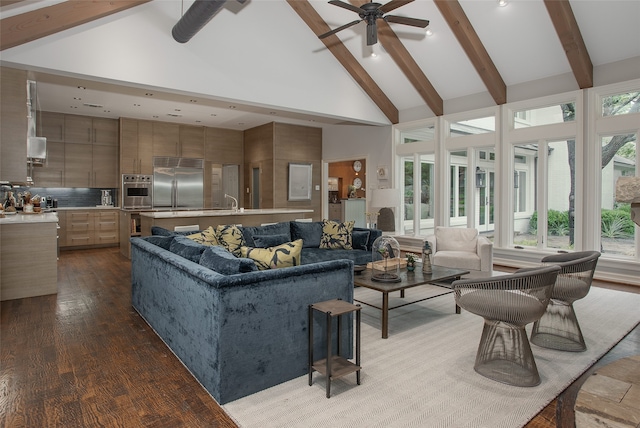 living room featuring wood-type flooring, beamed ceiling, high vaulted ceiling, and a wealth of natural light