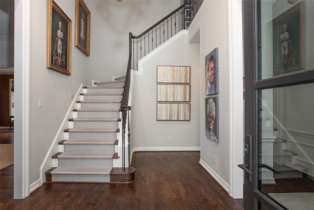 foyer with dark hardwood / wood-style flooring