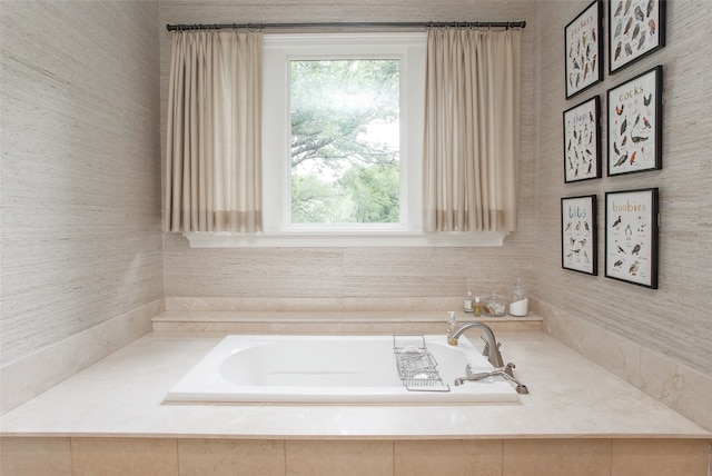 bathroom with tiled tub