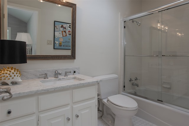 full bathroom featuring bath / shower combo with glass door, vaulted ceiling, vanity, and toilet