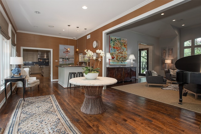 dining space featuring crown molding, dark hardwood / wood-style flooring, and a healthy amount of sunlight