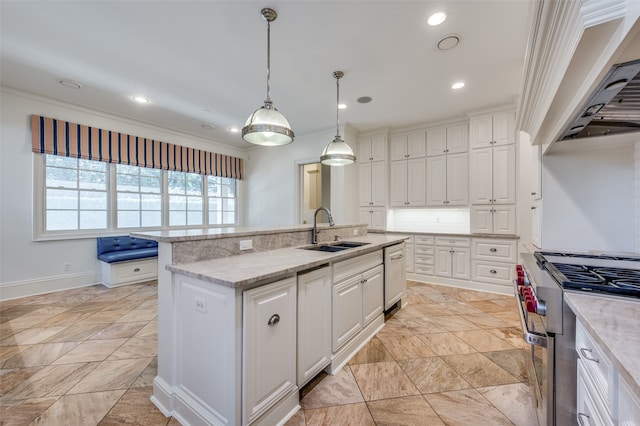 kitchen with premium range hood, sink, a center island with sink, stainless steel appliances, and crown molding