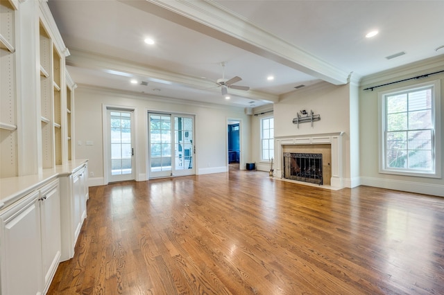 3025 Westminster Ave, University Park, TX 75205 - unfurnished living room with ornamental molding, a healthy amount of sunlight, and a fireplace