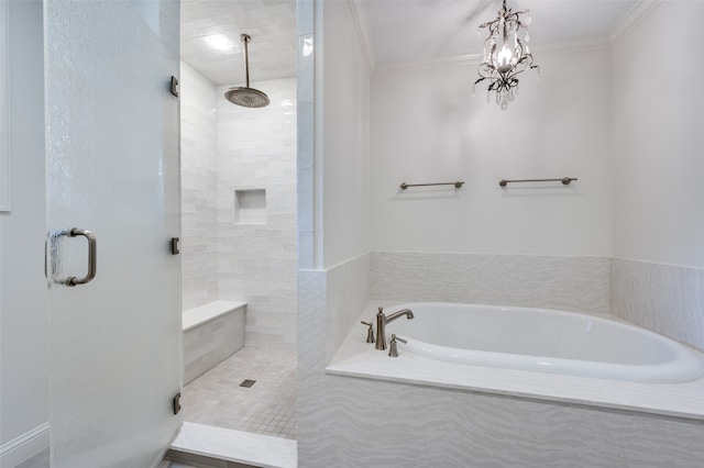 bathroom featuring an inviting chandelier, separate shower and tub, and ornamental molding