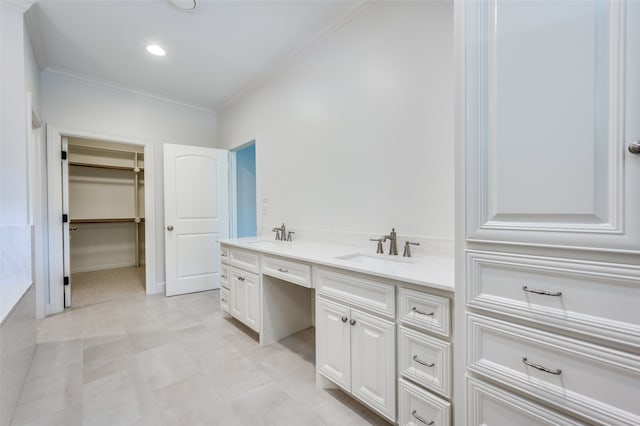 bathroom with crown molding and vanity