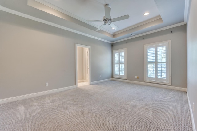 3025 Westminster Ave, University Park, TX 75205 - spare room featuring crown molding, light colored carpet, a ceiling fan, a raised ceiling, and baseboards