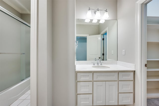 3025 Westminster Ave, University Park, TX 75205 - full bath featuring ornamental molding, combined bath / shower with glass door, tile patterned floors, and vanity