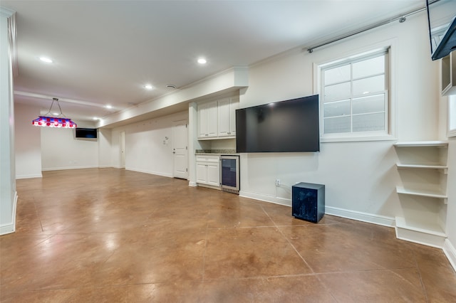 unfurnished living room featuring beverage cooler and ornamental molding