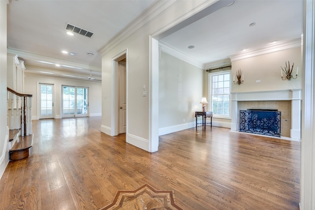 3025 Westminster Ave, University Park, TX 75205 - unfurnished living room with ornamental molding, visible vents, baseboards, and wood finished floors