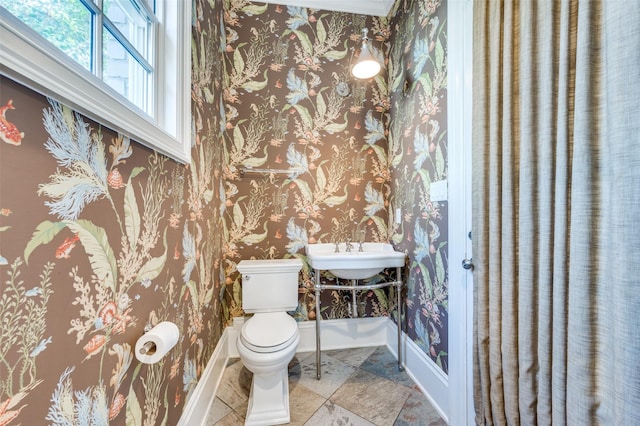 3025 Westminster Ave, University Park, TX 75205 - half bathroom featuring baseboards, wallpapered walls, and toilet