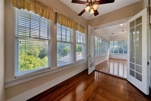 unfurnished room featuring ceiling fan and hardwood / wood-style floors