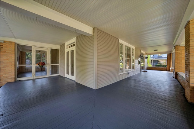 deck with a porch and french doors