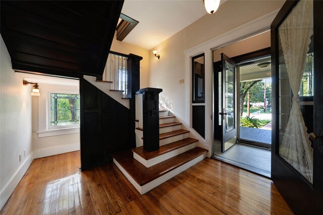 spare room with ceiling fan, wood-type flooring, and ornamental molding