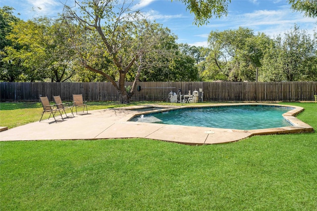 view of pool featuring a lawn and a patio area