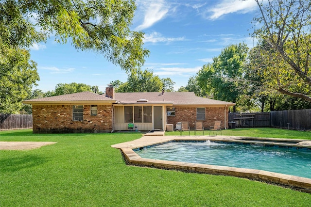 view of pool featuring a patio and a yard